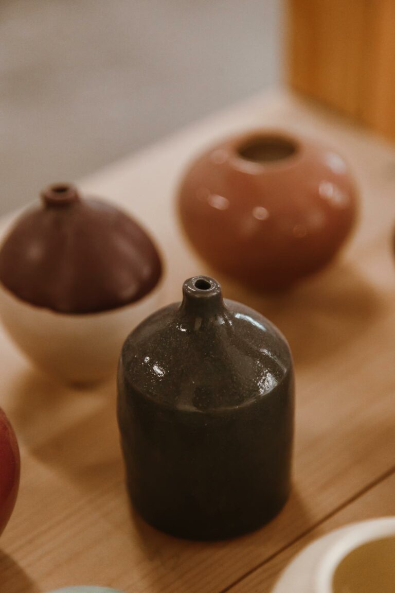 A still life arrangement of glazed ceramic vases showcasing artistic craftsmanship.